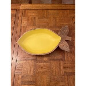 Wooden lemon shaped bowl with yellow inside